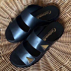 L’Intervalle Black Slide Sandals with Gold Accents